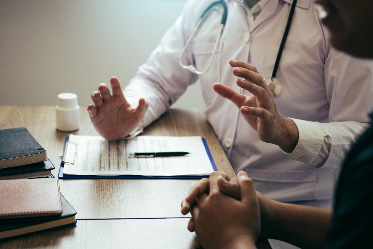 Doctor is explaining the treatment about the possible treatment of patients in the future.